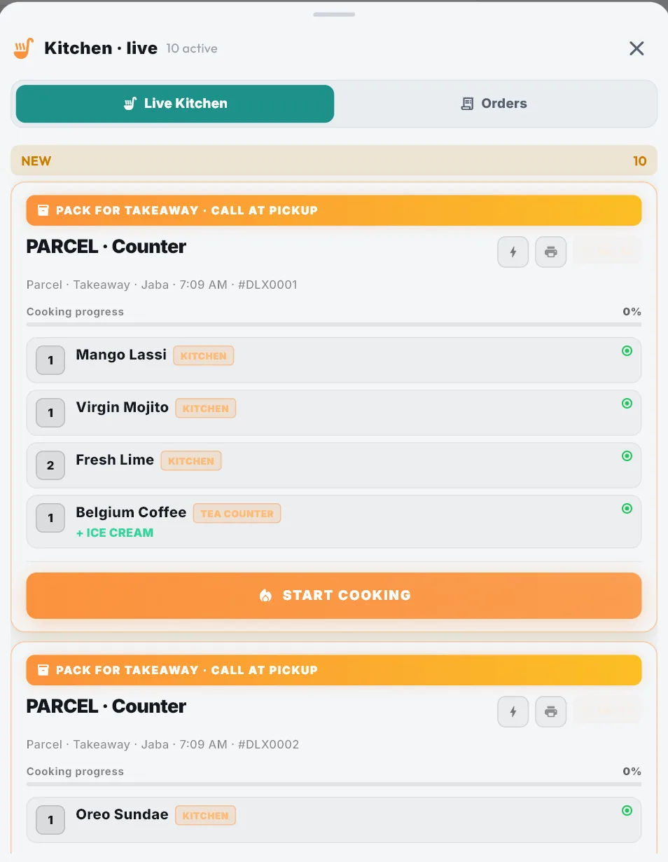 The live kitchen board: a takeaway order with each dish tagged KITCHEN or TEA COUNTER and an ice-cream extra under the coffee.